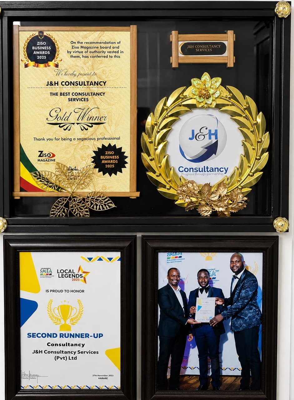 J&H Consultancy awards wall — ZISO Business Awards Gold Winner and SMEA Local Legends recognition